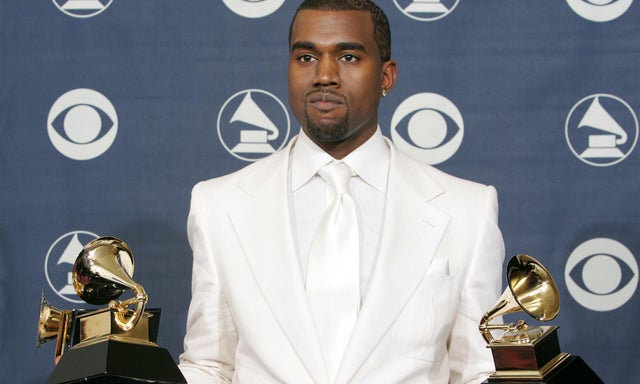 US rapper Kanye West holds his three Gra 