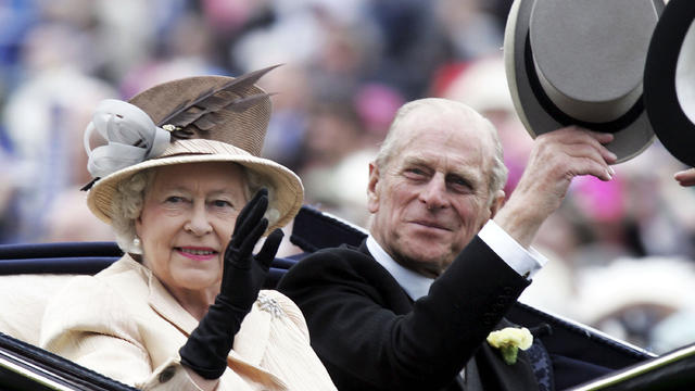 Queen Elizabeth II and husband Prince Philip, Duke of Edinburgh, arrive on the third day of Royal Ascot at York Racecourse on June 16, 2005, in York, England. 