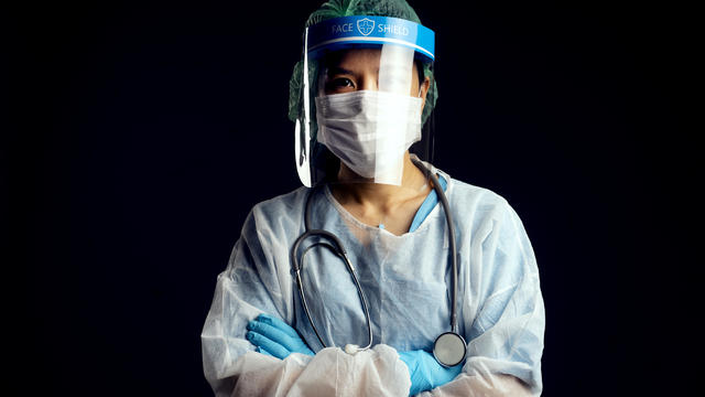 doctor in PPE suit uniform has stress in Coronavirus outbreak  and Emotional stress of overworked doctor and medical care team during covid-10 period. 