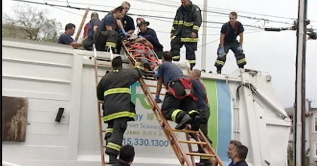 Man is almost crushed to death in recycling truck - CBS News