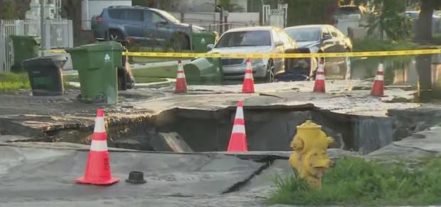 Water Main Break Floods Streets Of South LA Neighborhood, Creates Massive Sinkhole 