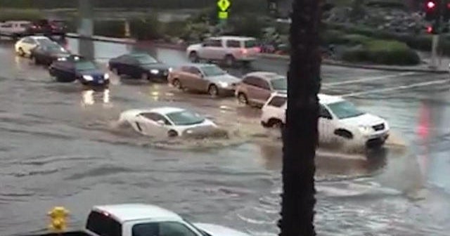 takes on California flood waters CBS News
