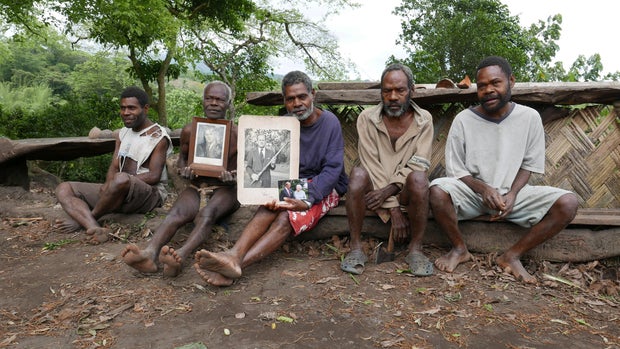 Tanna locals hold pictures of Prince Philip