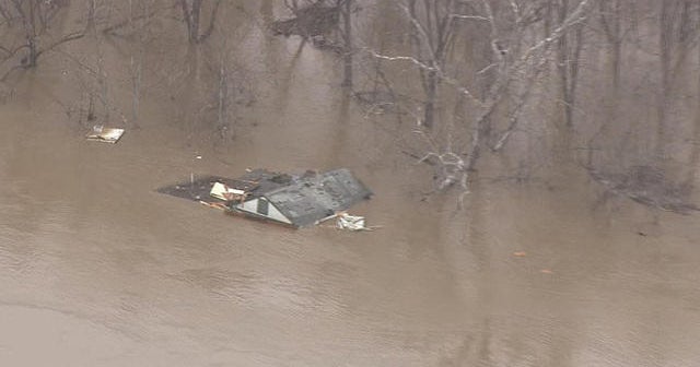 Missouri homes in danger as rising rivers spill over levees - CBS News