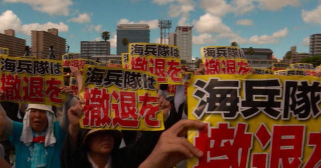 Japanese protest U.S. bases in Okinawa after woman's death - CBS News