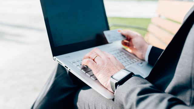 graphicstock-close-up-on-the-hands-of-man-shopping-online-using-laptop-and-credit-card-shopping-online-store-concept_STzWSYtyZ.jpg 