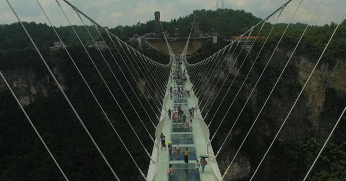 China reopens world's highest, longest glass bridge - CBS News