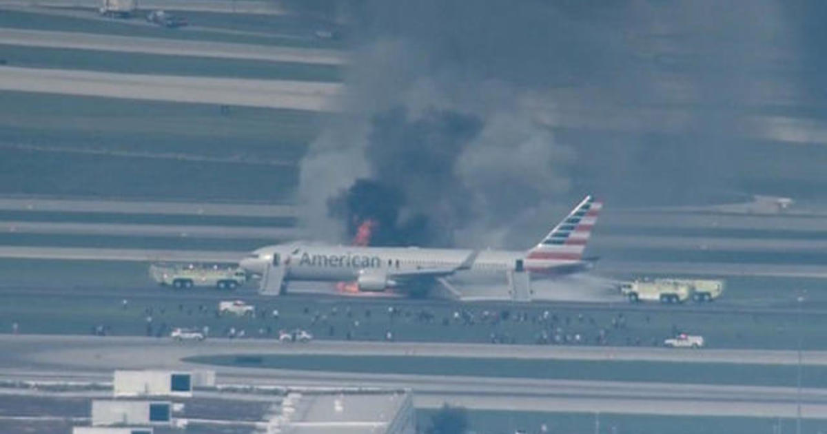 Panicked passengers flee fire on American Airlines flight CBS News