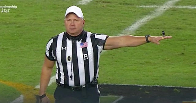 Buff ref turns college football championship into gun show - CBS News