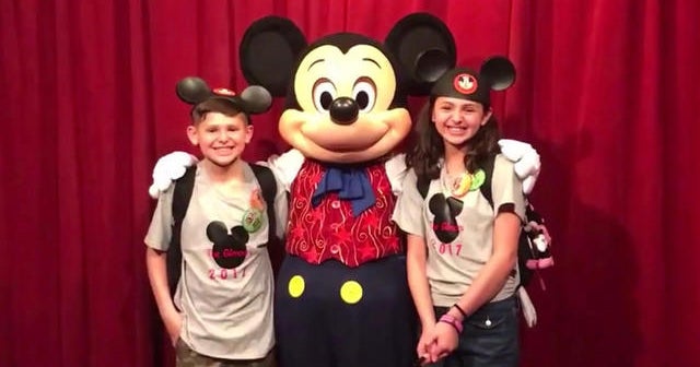 Mickey Mouse helps tell kids their official adoption date CBS News(00)