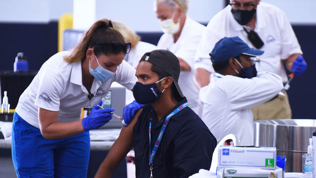 Nurses give crew members from the Carnival Liberty cruise 