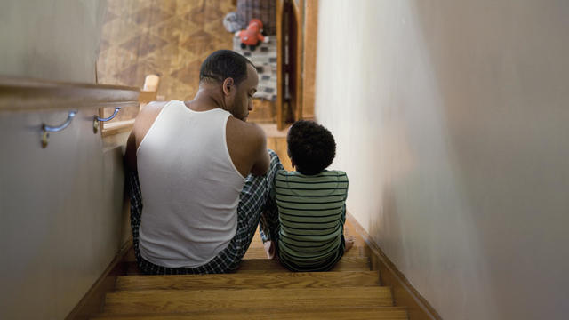 Father sitting with son on the stairs 
