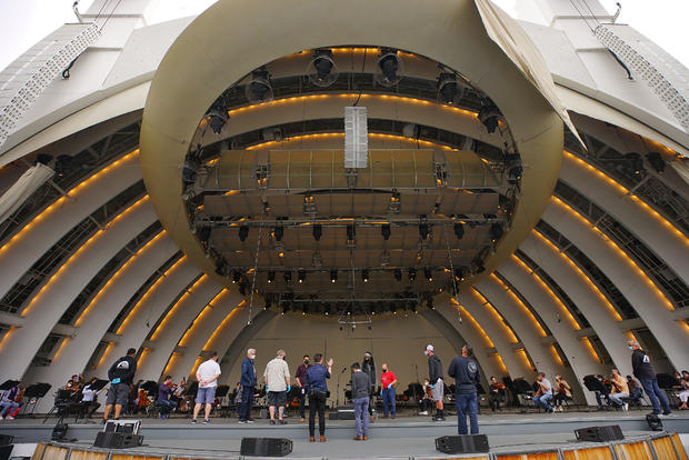 the Los Angeles Philharmonic during rehearsal May 12th at The Hollywood Bowl as the sleeping venue is rousing after 18 months of pandemic-induced hibernation. A behind-the-scenes look at what it takes, reveals a Los Angeles Philharmonic rehearsal, buzzing 