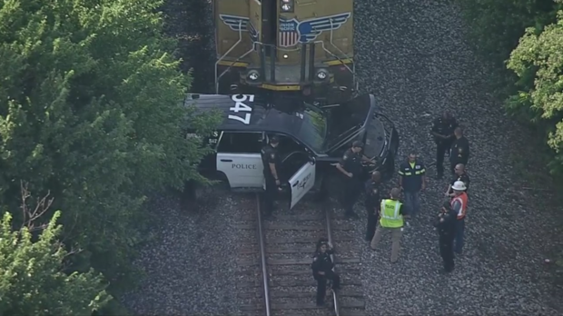 Fort Worth Police cruiser struck by train 