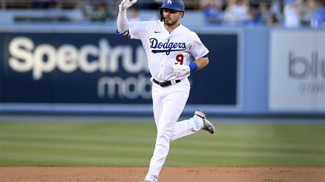 FILE - In this June 20, 2017, file photo, Los Angeles Dodgers' Cody  Bellinger, right, and Justin Turner celebrate Bellinger's two-run home run  during the first inning of a baseball game against