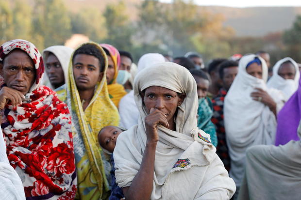 Women stand in line to receive food donations, at the Tsehaye primary school, in the town of Shire, Tigray region 