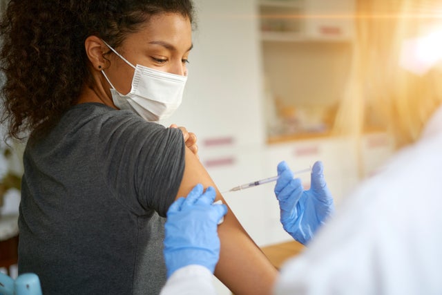covid vaccine Young woman getting vaccinated