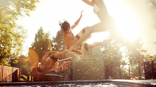 Three friends enjoying a day at the pool. 
