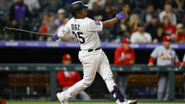 Elias Diaz of the Colorado Rockies celebrates with Brendan Rodgers