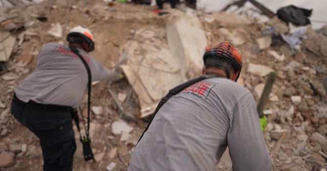 Rescue workers battle storms as Surfside condo collapse search ...