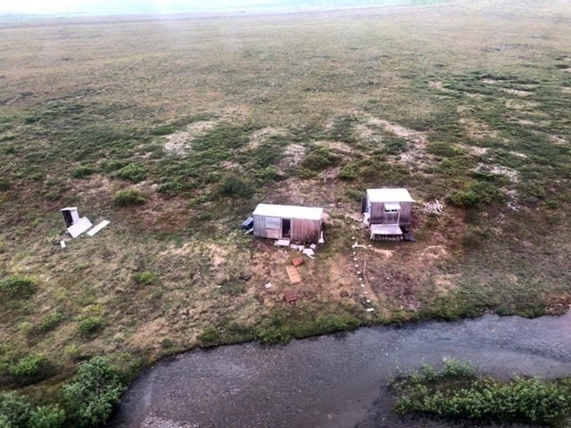 An aerial photo shows a remote mining camp near Nome, Alaska, where a U.S. Coast Guard helicopter crew rescued a survivor of a bear attack July 16, 2021. 