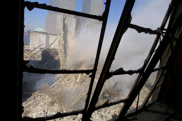 Rescue Workers Search Through WTC Rubble 