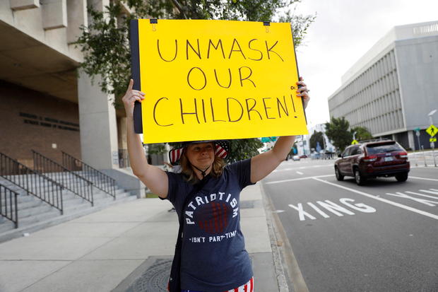 FILE PHOTO: People protest against the school mask mandate in Tampa 