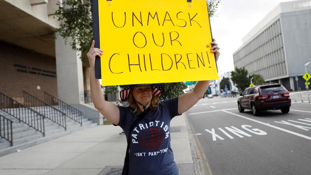 FILE PHOTO: People protest against the school mask mandate in Tampa 