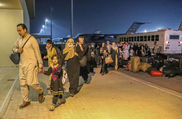 Evacuees from Afghanistan arrive at Al-Udeid airbase in Doha 