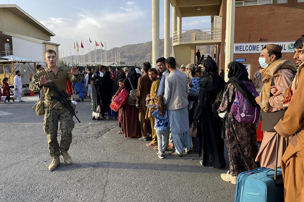 Afghans prepare to board U.S. military flights to leave Kabul and the Taliban 