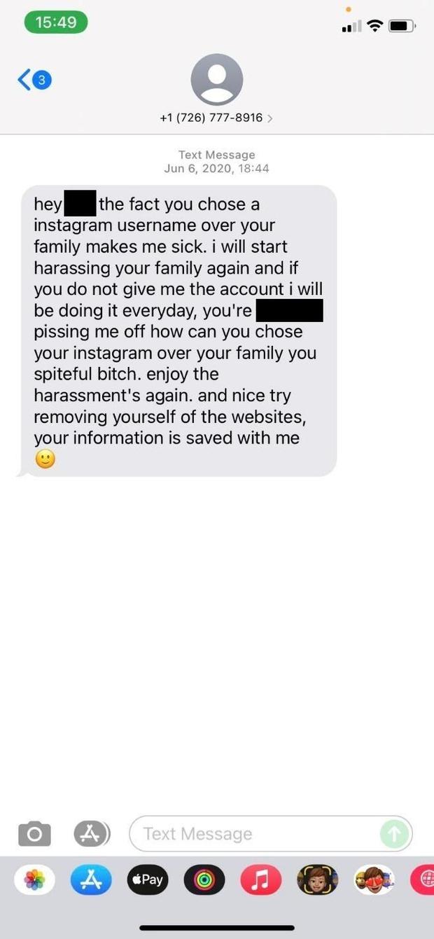 This screenshot shows a harassing text message received by a social media user who refused to give up her username. 