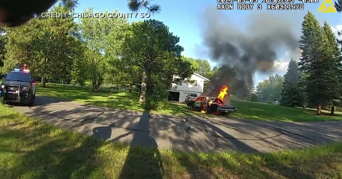 WATCH Chisago County Deputy Hauls Flaming Car Away From Home CBS
