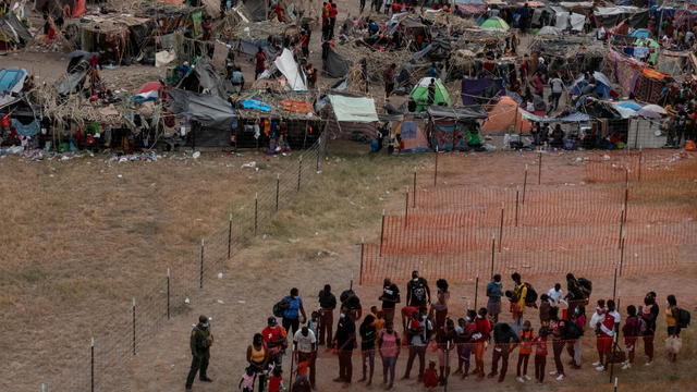 Migrants shelter near International Bridge in Del Rio, Texas 