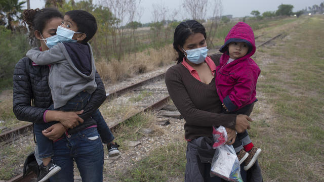 Refugee families cross into the United States along the Mexican Border 