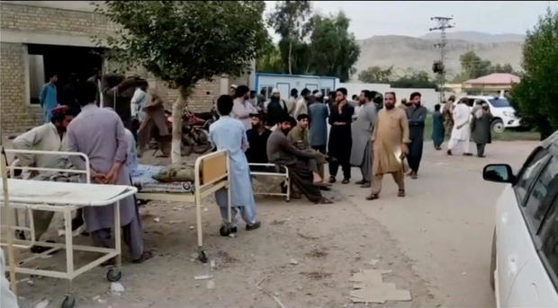 Social media video still of people gathering outside a hospital following an earthquake in Harnai, Pakistan 