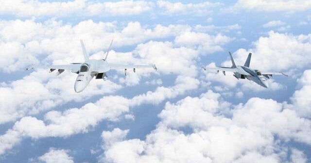 The Navy is extending the range of its fighter jets by using unmanned aircraft for refueling - CBS News