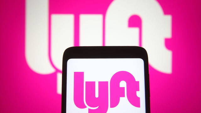 In this photo illustration the Lyft logo of an US 