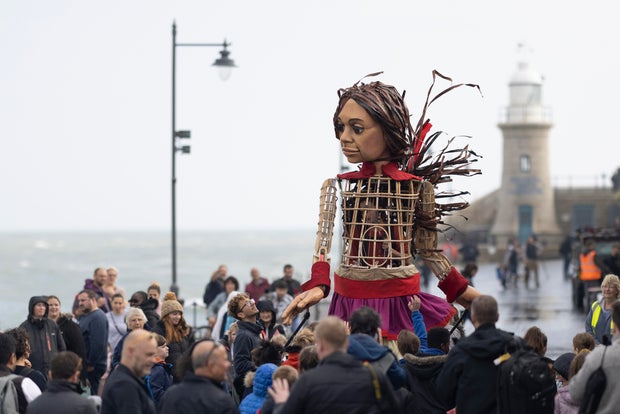 'Little Amal', Migrant Puppet Traversing Europe, Arrives In England