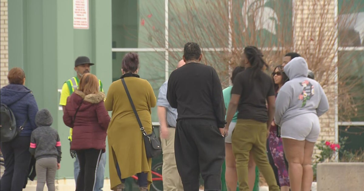 Aurora Central High School Parents Wait To Pick Up Students After ...