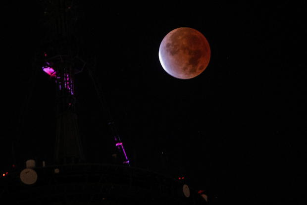 The moon undergoes a partial lunar eclipse as seen from New York City 