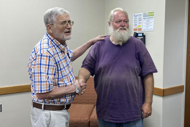 Ernest Ray, right, shakes the hand of his attorney Hugh O'Donnell at the Virginia Higher Education Center in Abingdon, Virginia, August 17, 2021. 