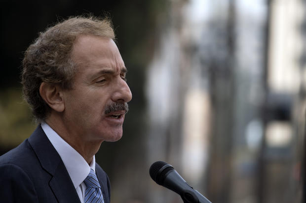 City Attorney and mayoral candidate MikeFeuer speaks during a press conferance in front of City Hall 