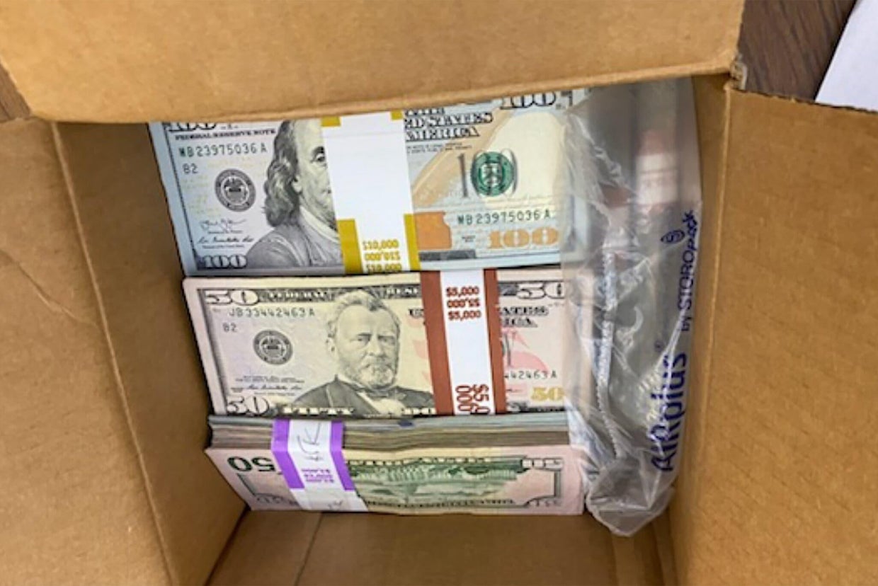 A physics professor was opening his mail when he found a box. Inside ...