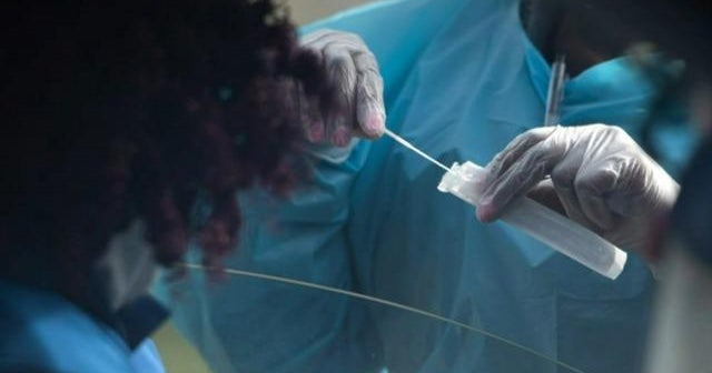 Omicron cases rise in U.S., causing businesses and schools to rethink