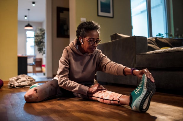 Senior woman exercising at home 