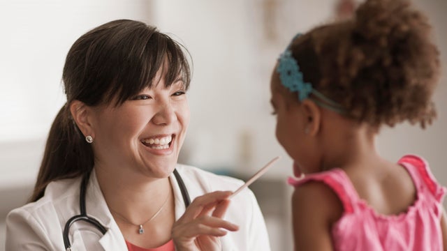 Girl having checkup in doctor's office 