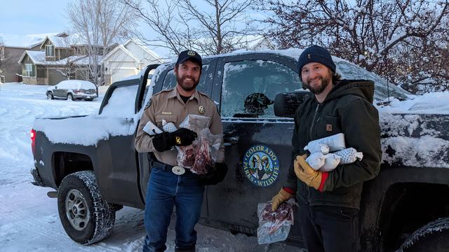 Marshall-Fire-Elk-Hunter-1-CPW-officer-Sam-Peterson-left-after-donating-elk-meat-to-Fleetwood-Mathews-on-2-28-credit-CPW.jpg 