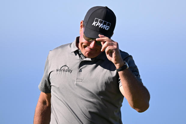 Phil Mickelson acknowledges the crowd after a putt on the fourth green during the first round of the Farmers Insurance Open golf tournament at Torrey Pines Municipal Golf Course on Jan. 27, 2022, in San Diego. 
