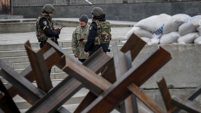 Police guard area as anti-tank constructions are seen in central Kyiv 