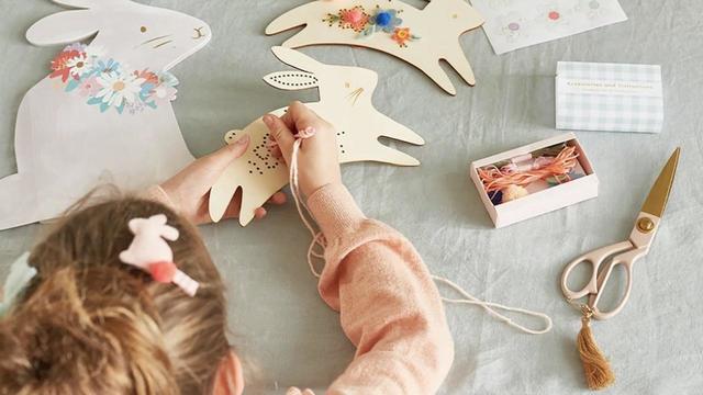 girl doing Easter crafts 